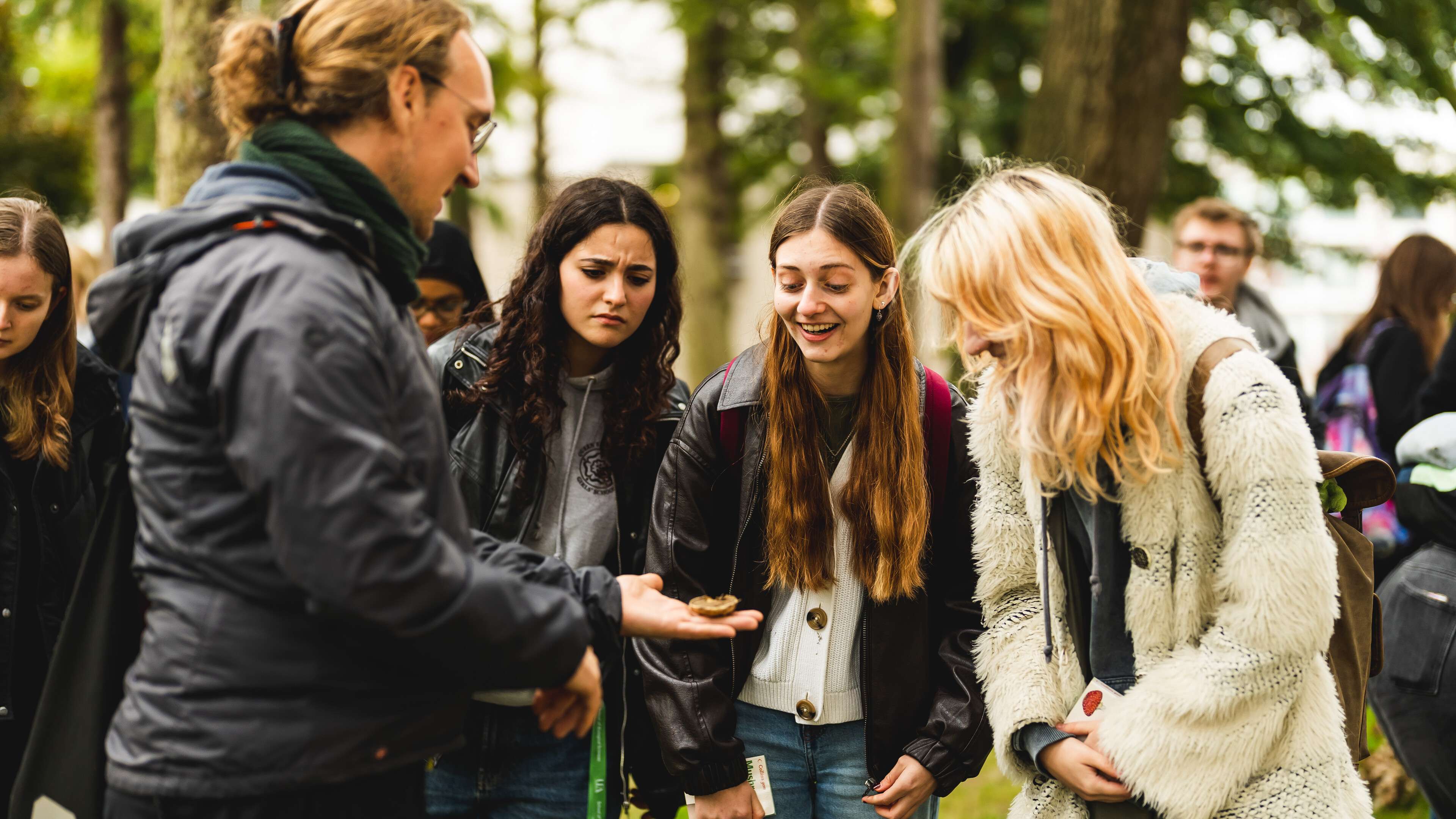 Biological science students exploring fungi on campus