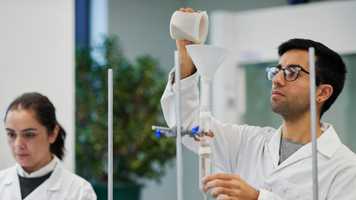 Mature students carrying out Natural Sciences experiment in New Science laboratory.