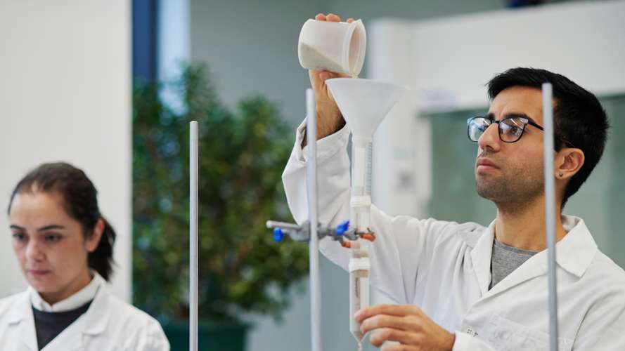 Mature students carrying out Natural Sciences experiment in New Science laboratory.
