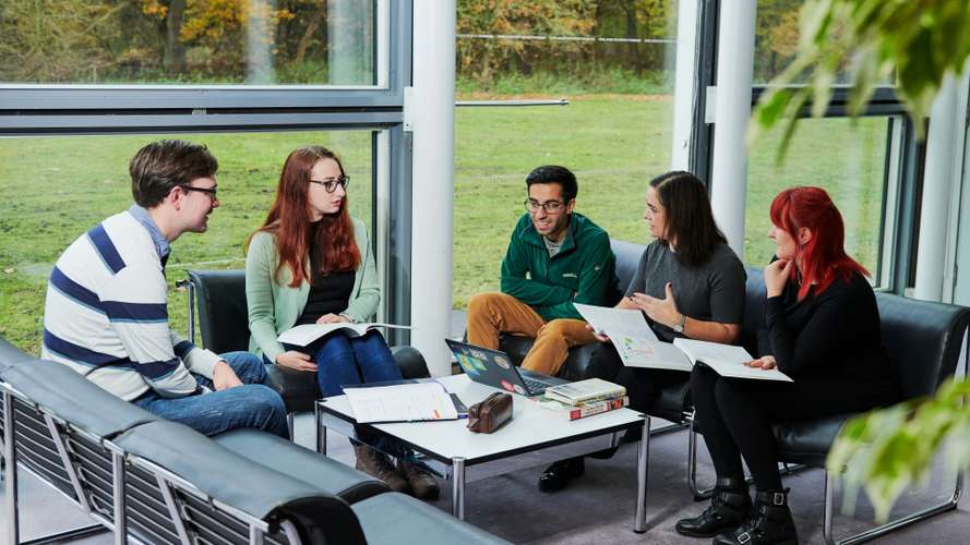 Mature students collaborating in Sainsbury Centre.