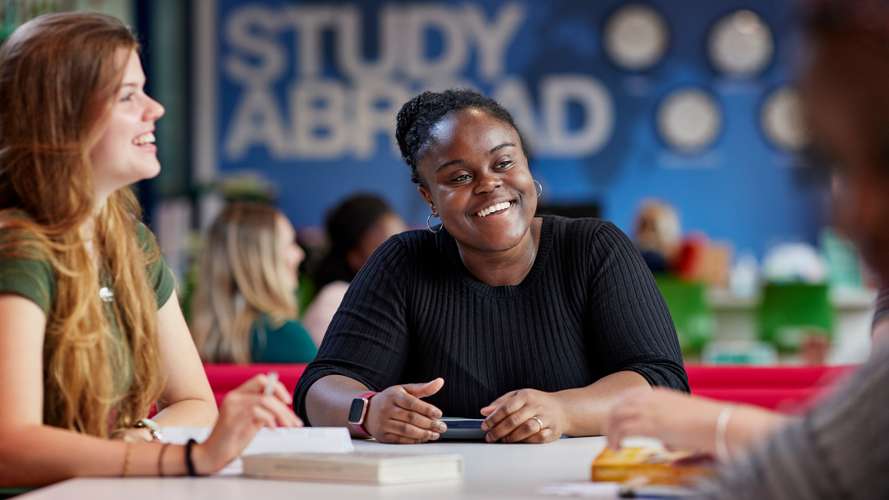 Students talking in Study Abroad office