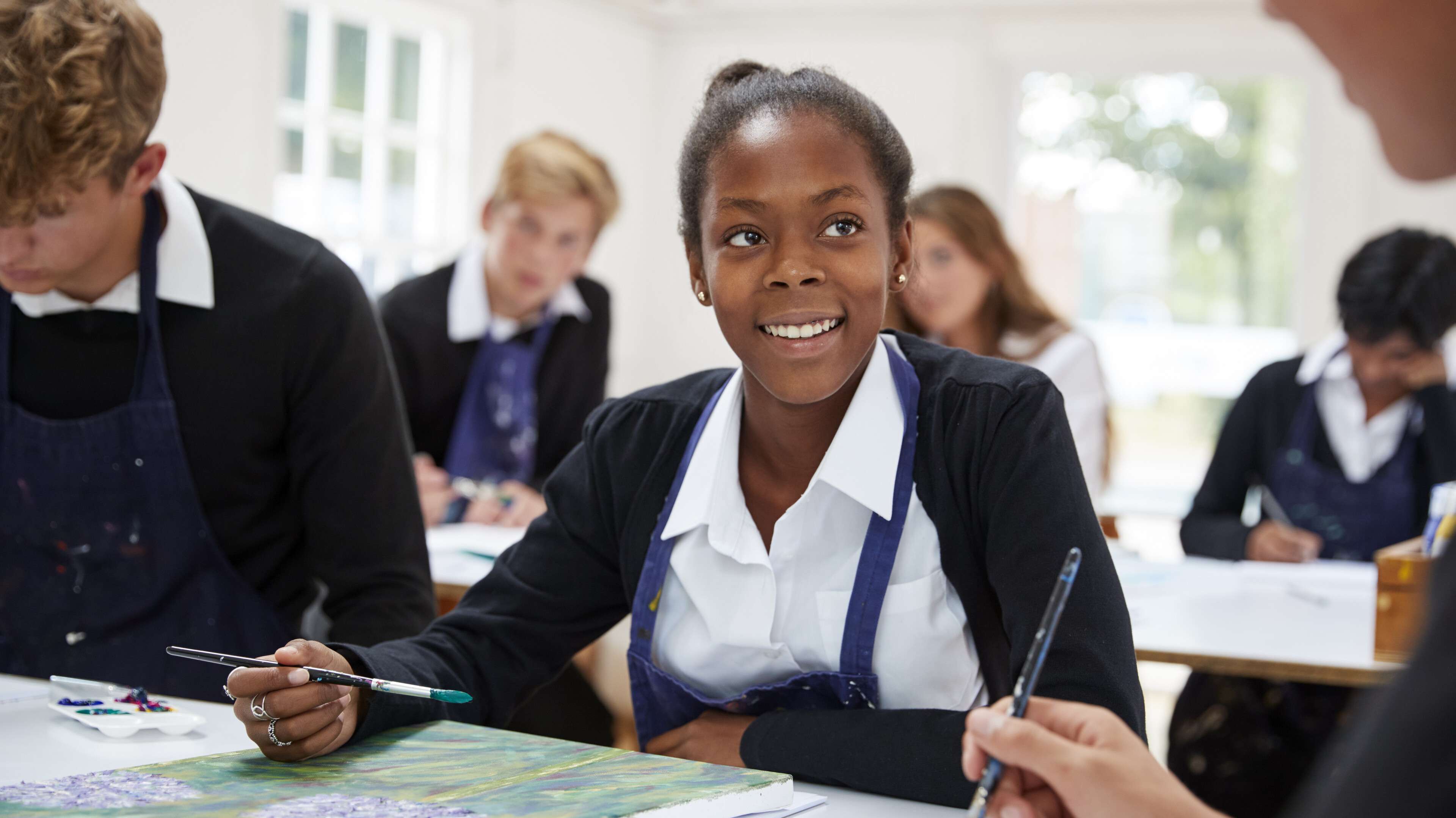 Group of teenage students in an art class