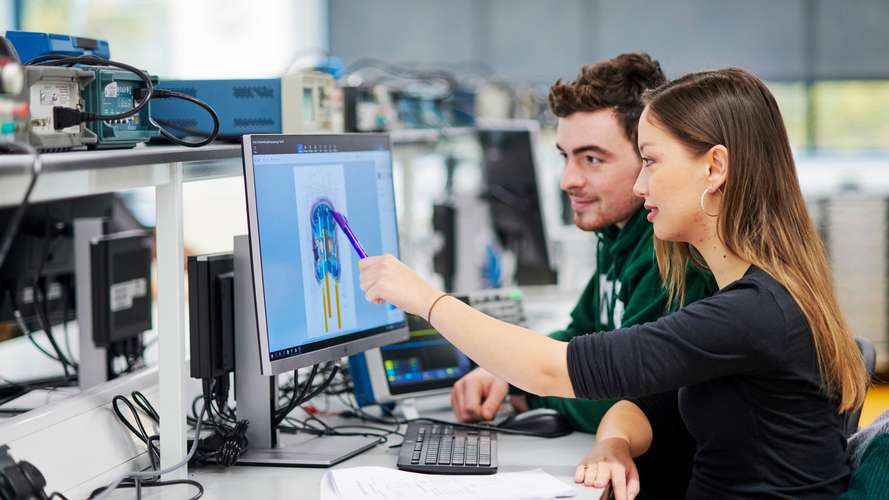 Mature students working in Electrical Engineering laboratory in New Science Building.
