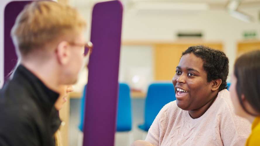 Mature students chatting, having coffee and socialising.