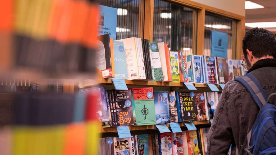 Students searching for books in a bookstore