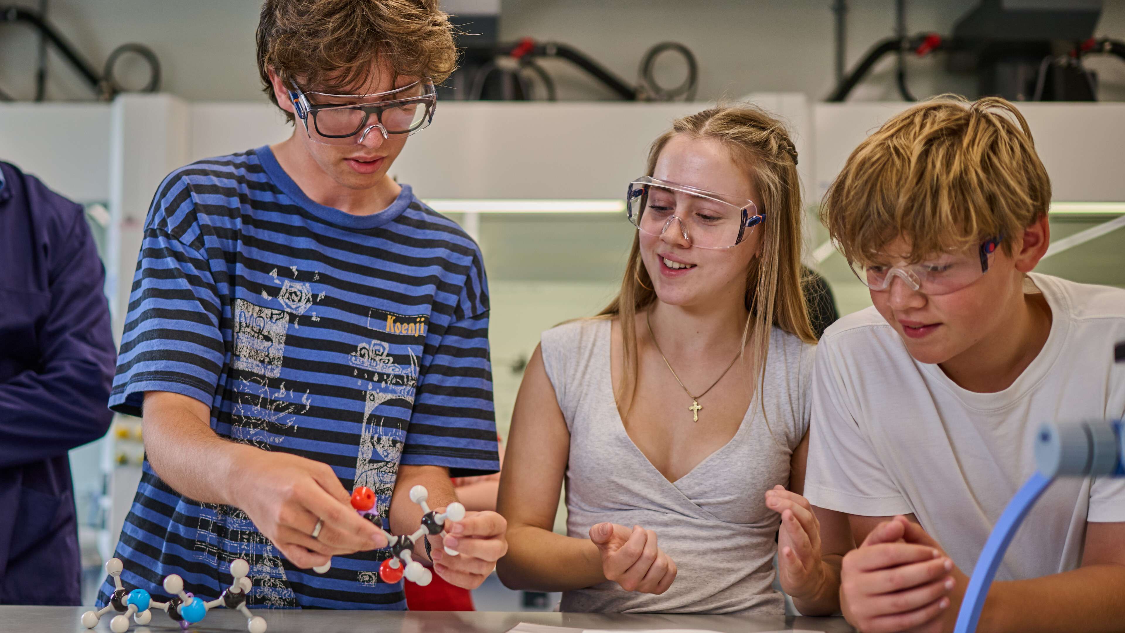 Students using models at an open day