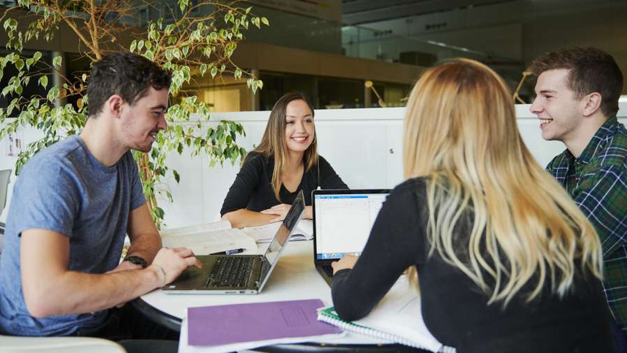 Mature students collaborating in Sainsbury Centre.