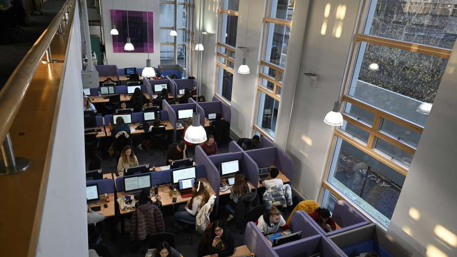 UEA students are pictured using one of the computer suites in the library on campus.