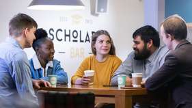 Postgraduate students socialising