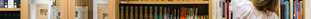Student looking through bookshelves