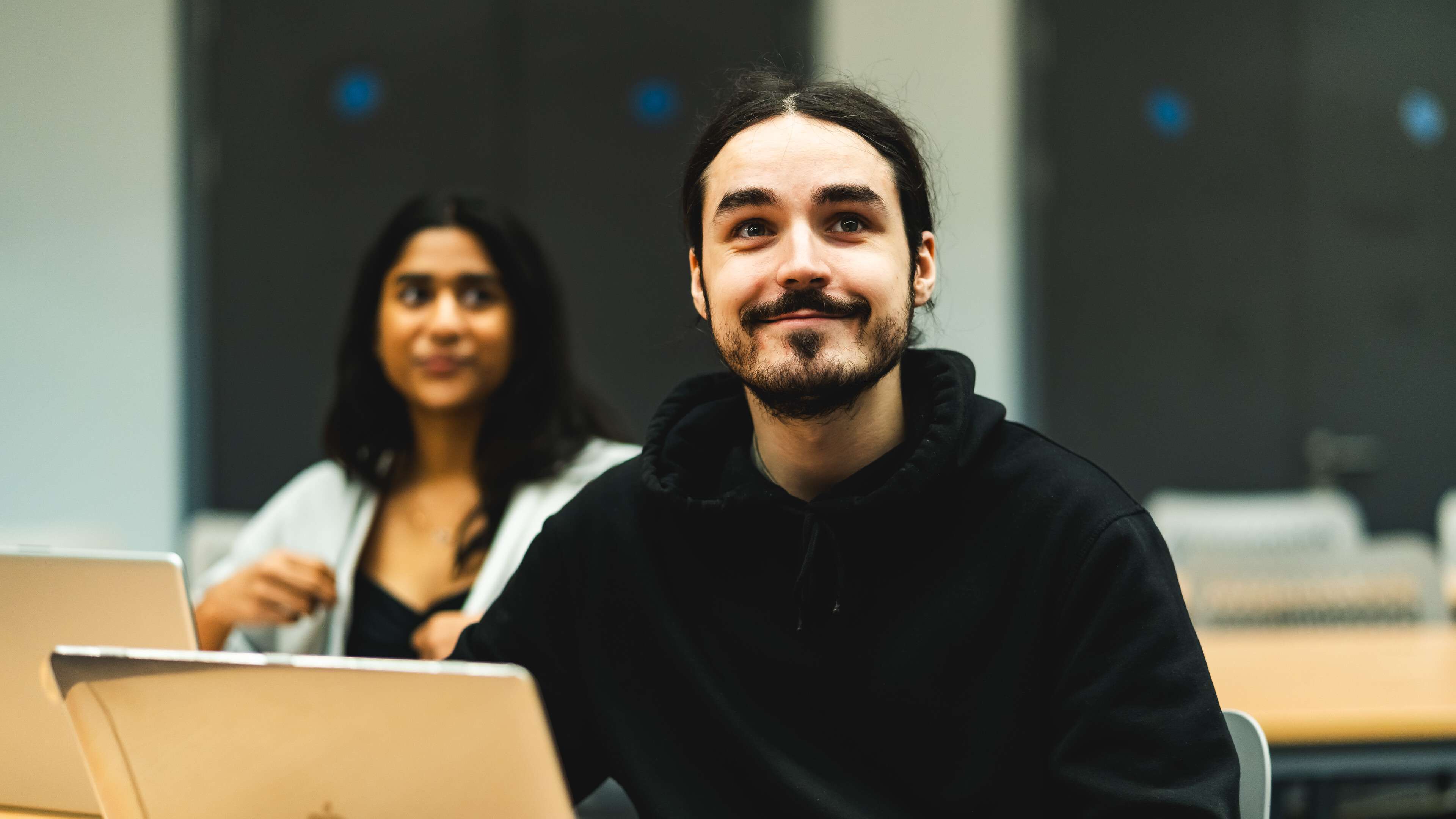 Students in a seminar with laptops
