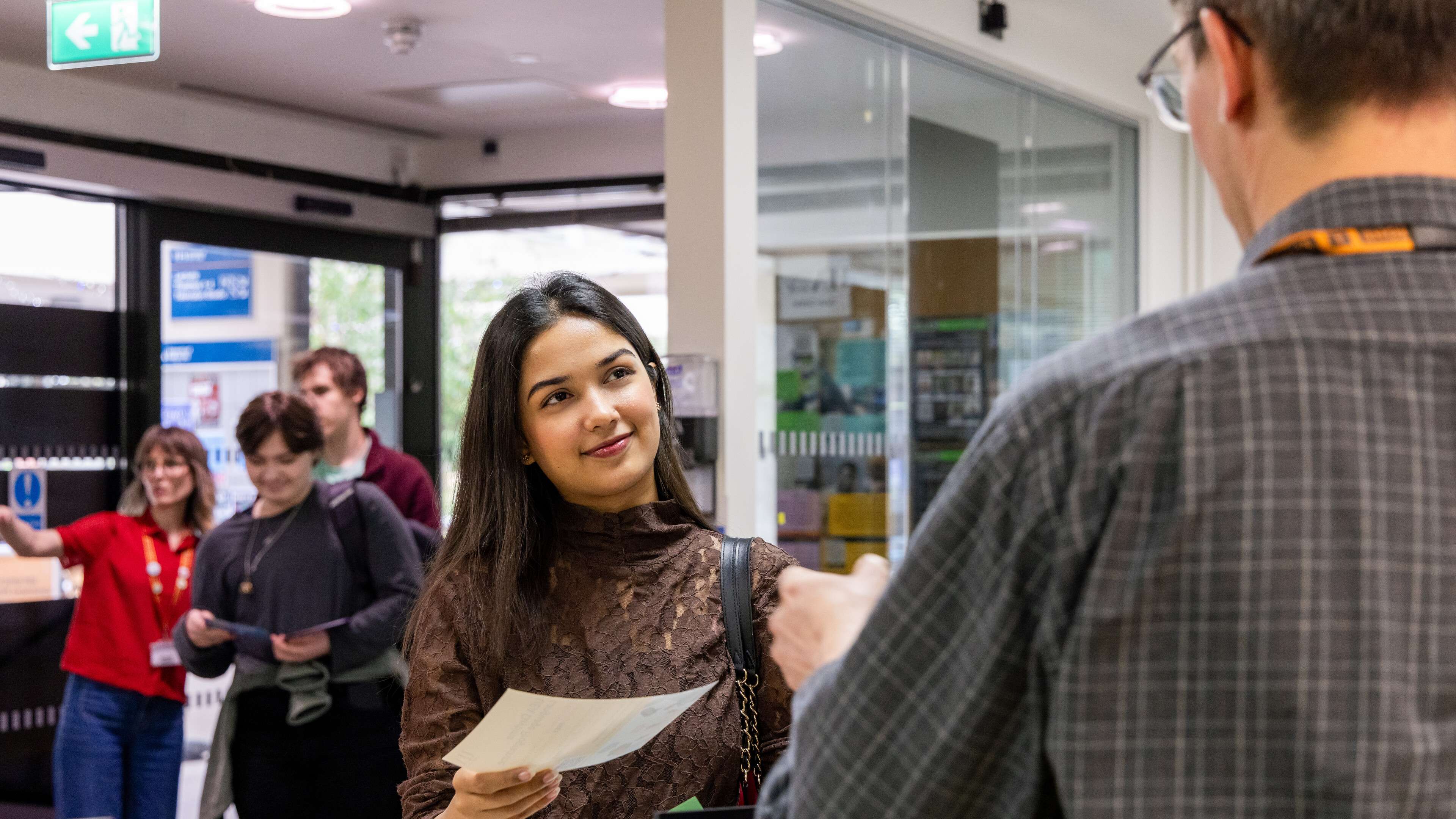 Students being assisted by advisers in the Student Information Zone