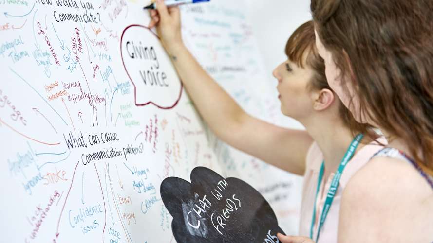 Student writing on white board