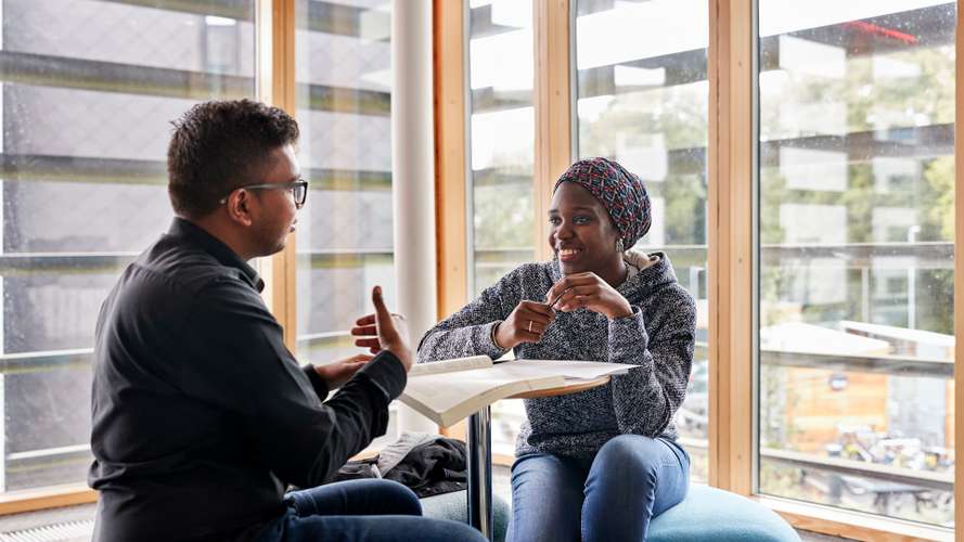 Postgraduate students talking