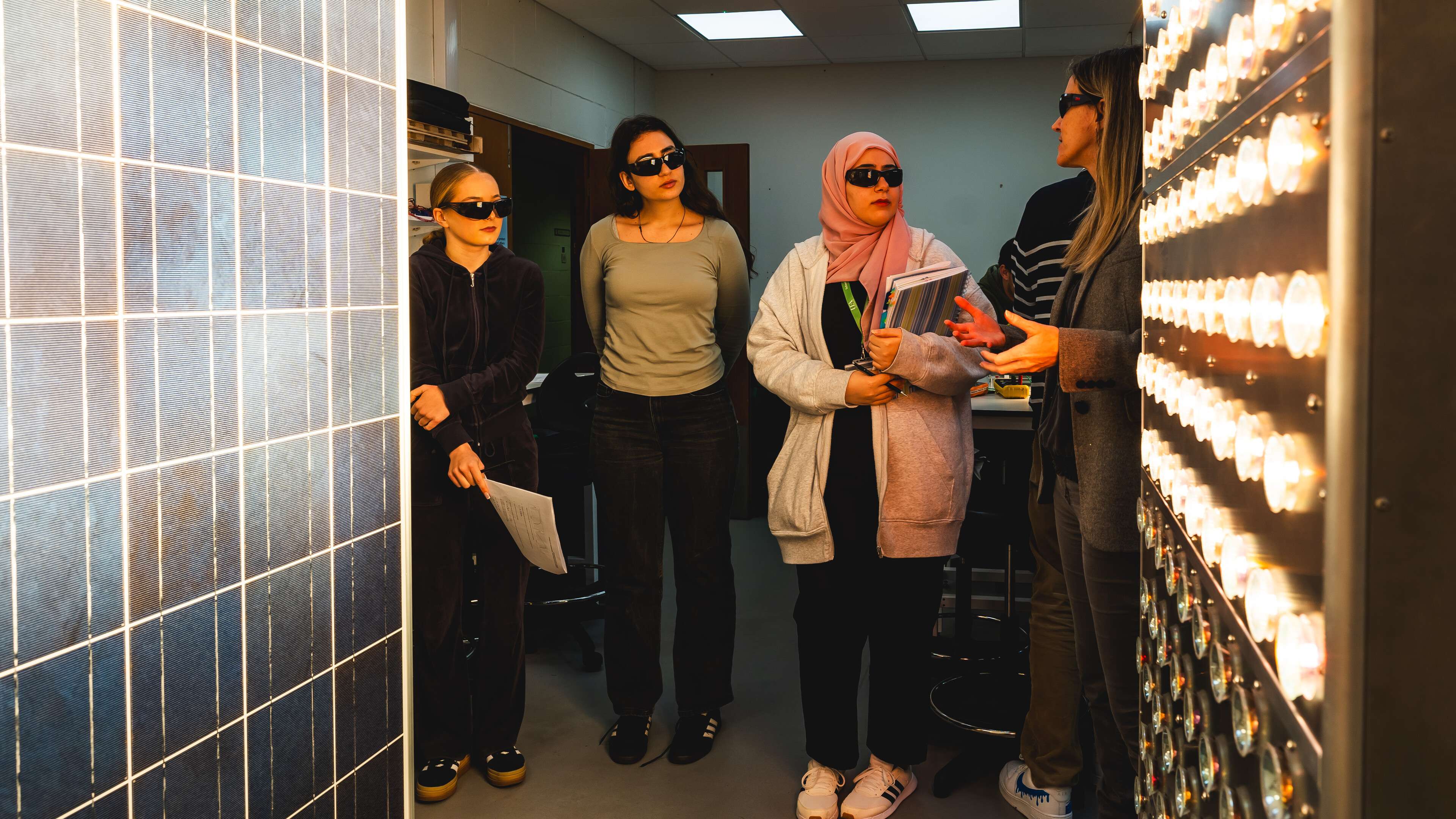 Engineering students using a light array in Productivity East