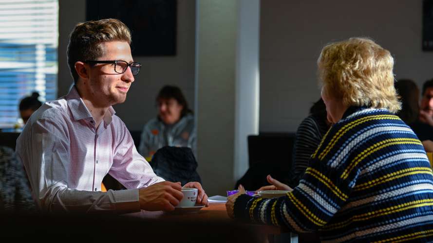 UEA staff members enjoying a coffee break together in the Vista cafe.