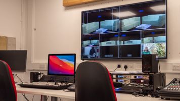 Control room, vision mixing desk, chairs and monitors at UEA's Broadcast house.