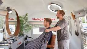 Hairstream barber with customer