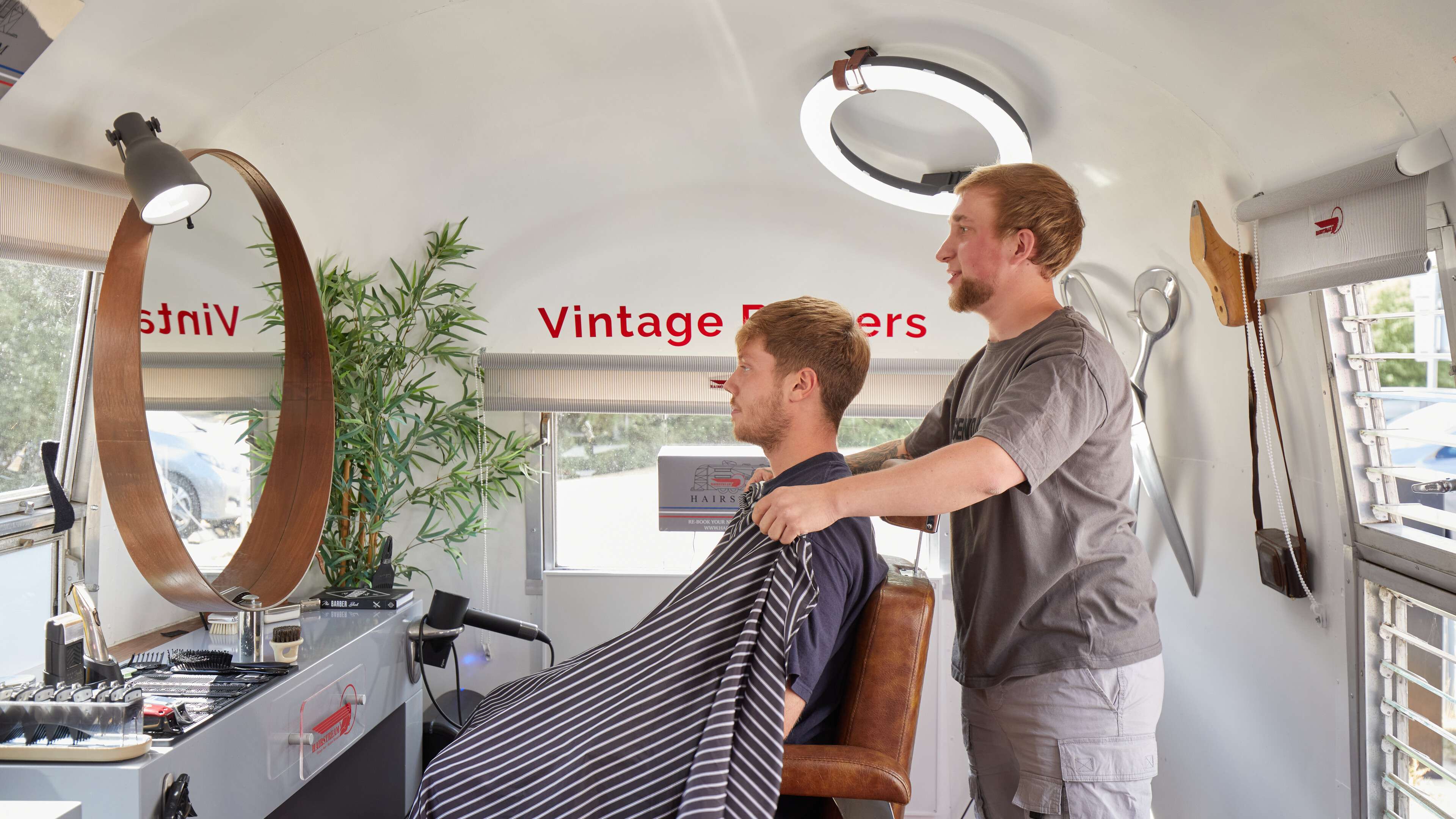 Hairstream barber with customer