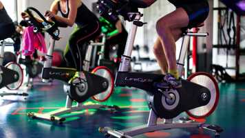 Gym users on bikes