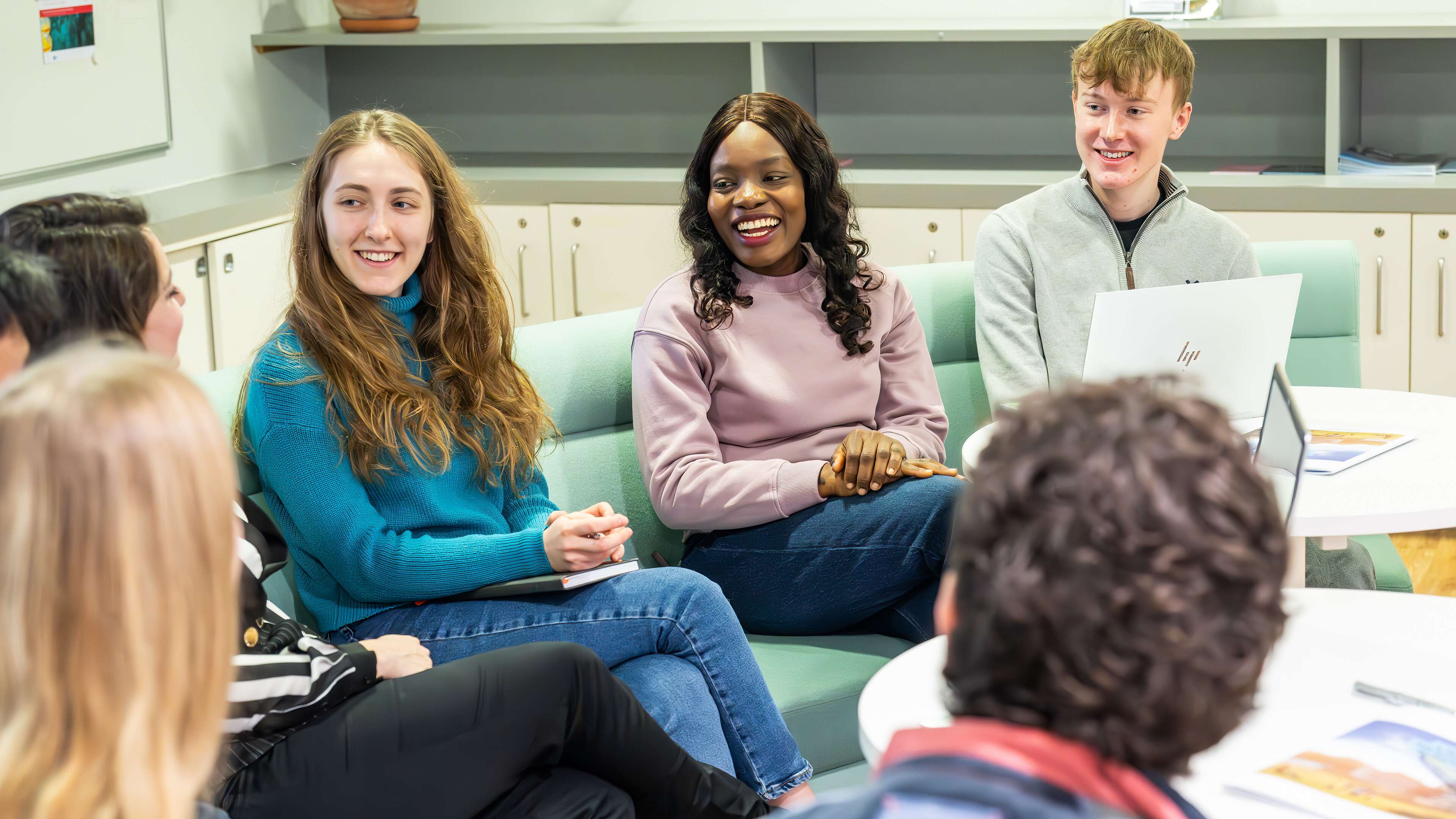 A group of economics students in discussion