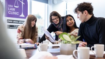 Law students working together in a law clinic session at Earlham Hall