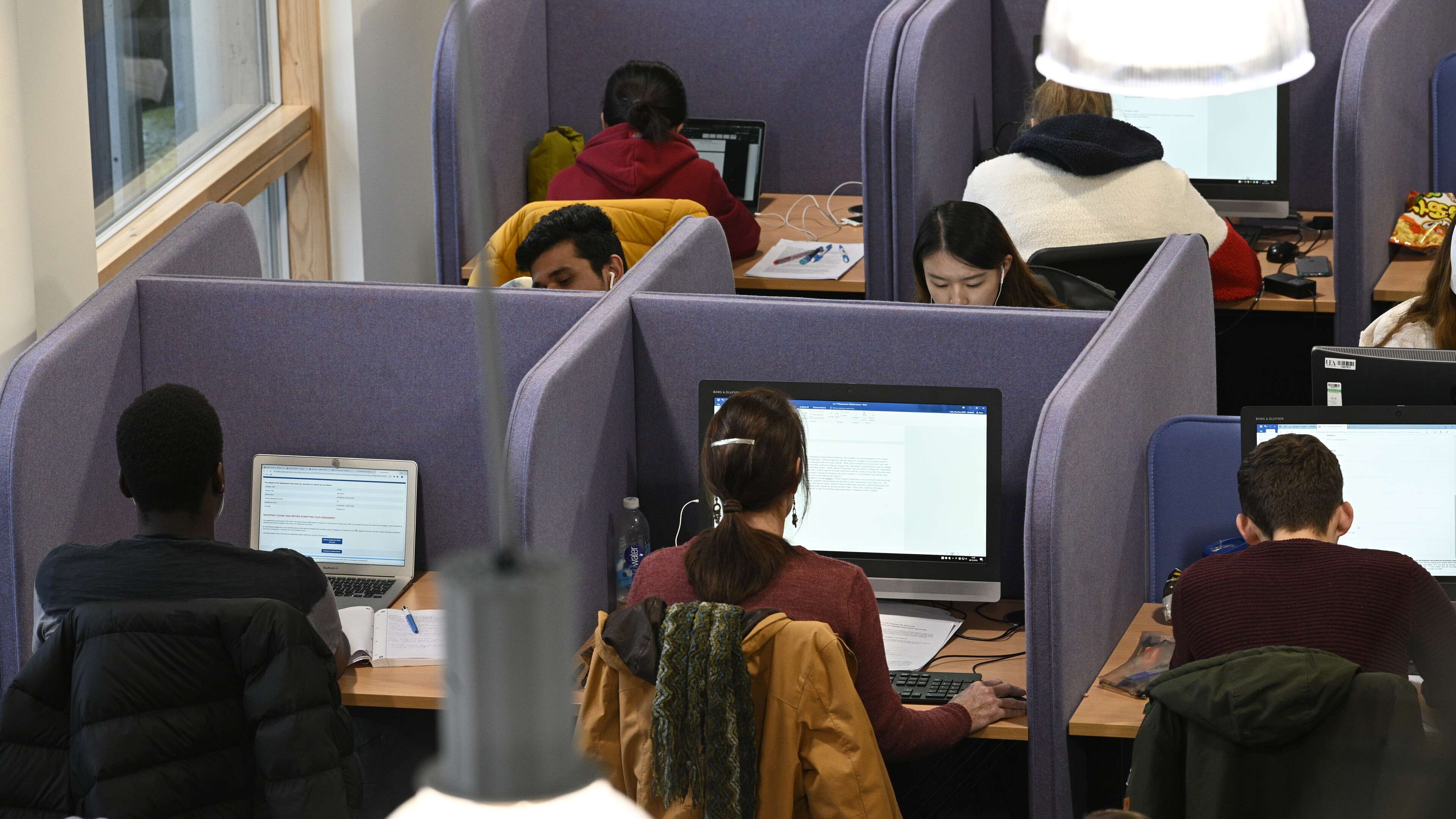 UEA students are pictured using one of the computer suites in the library on campus