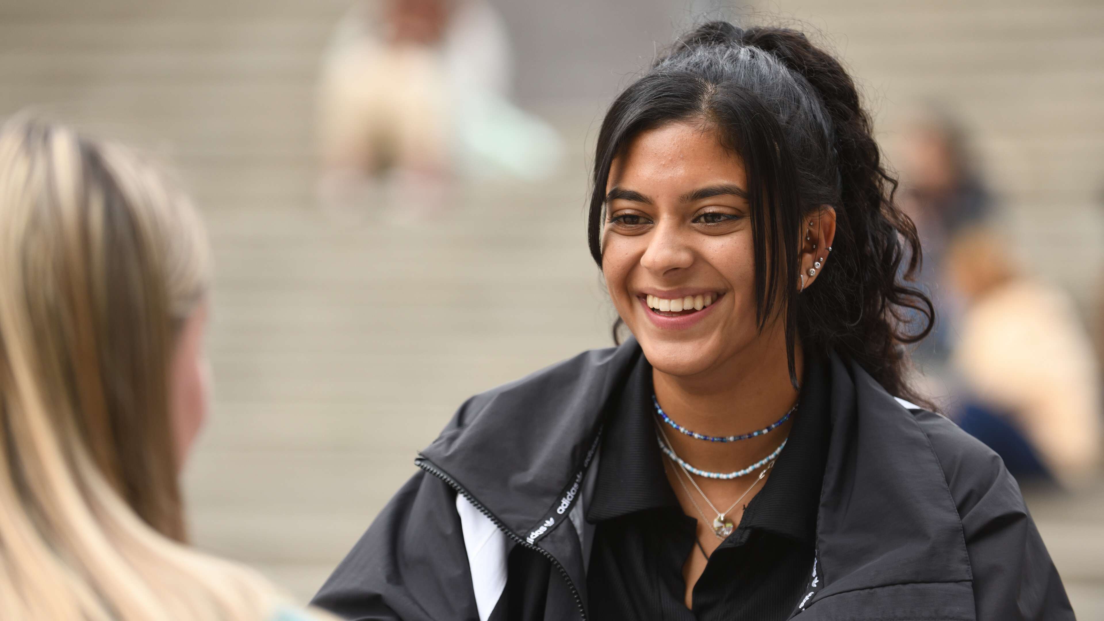 Student smiling in the square