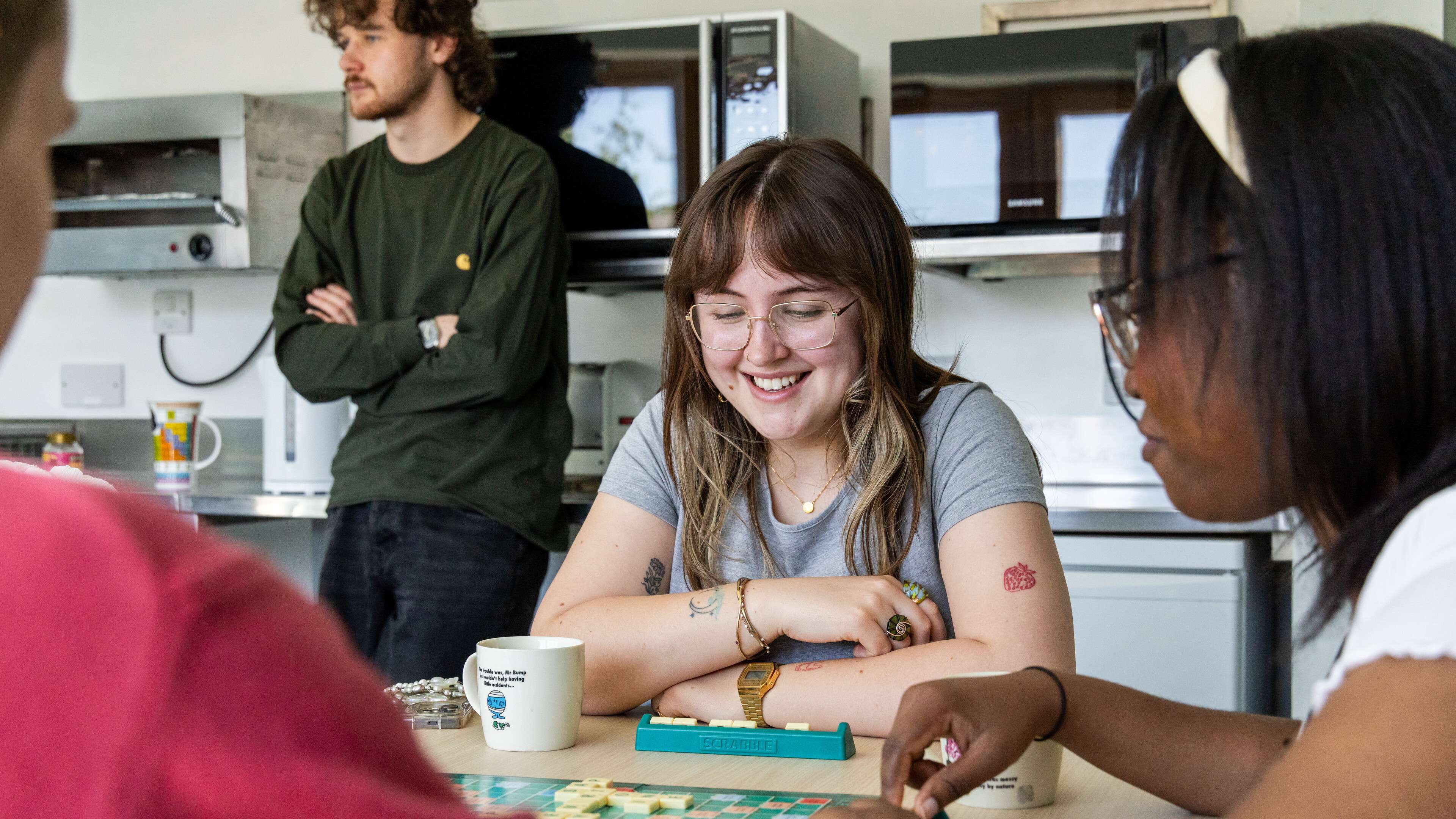 Students playing a board game in university accomodation
