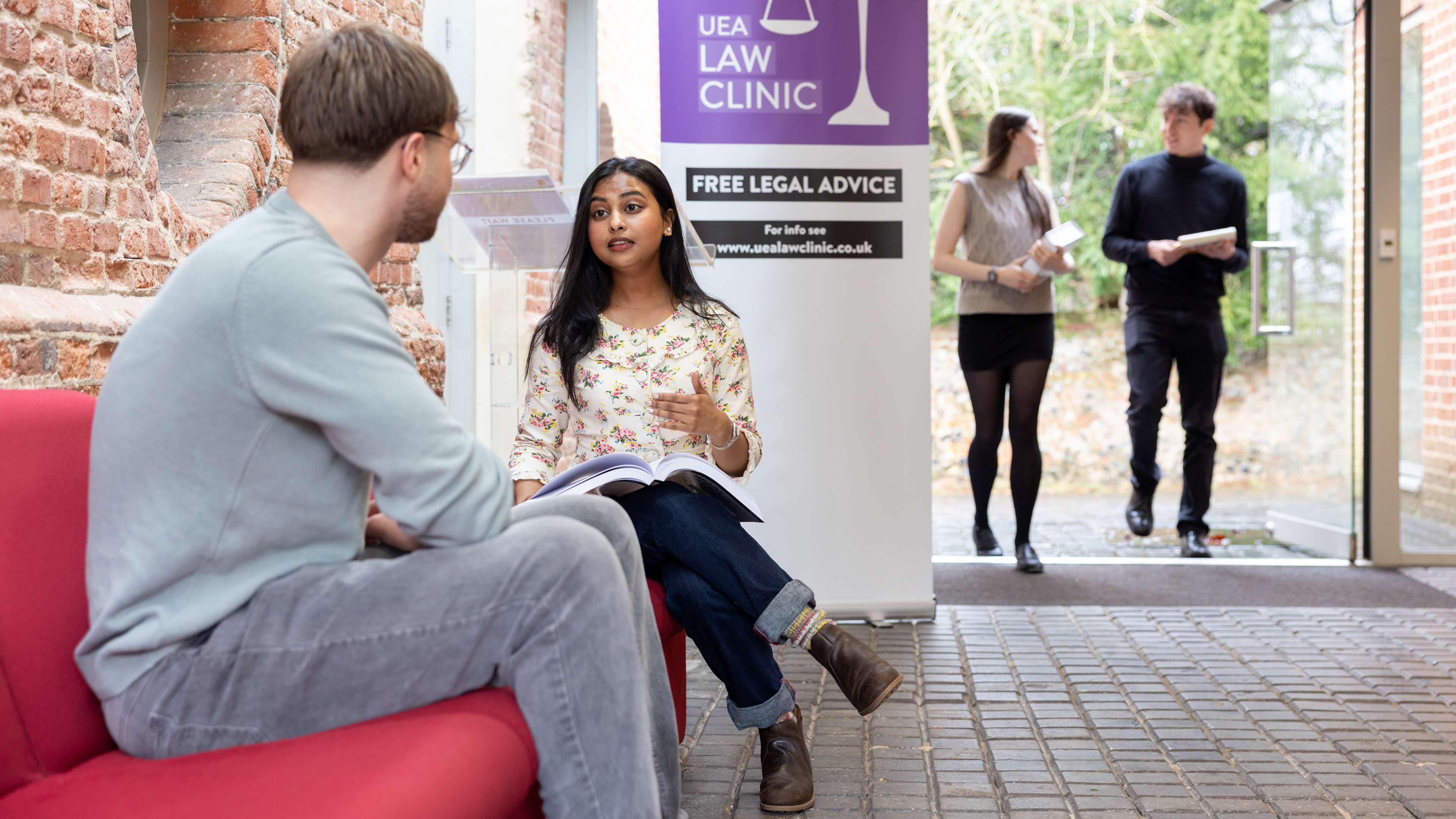 Law students working together in a law clinic session at Earlham Hall