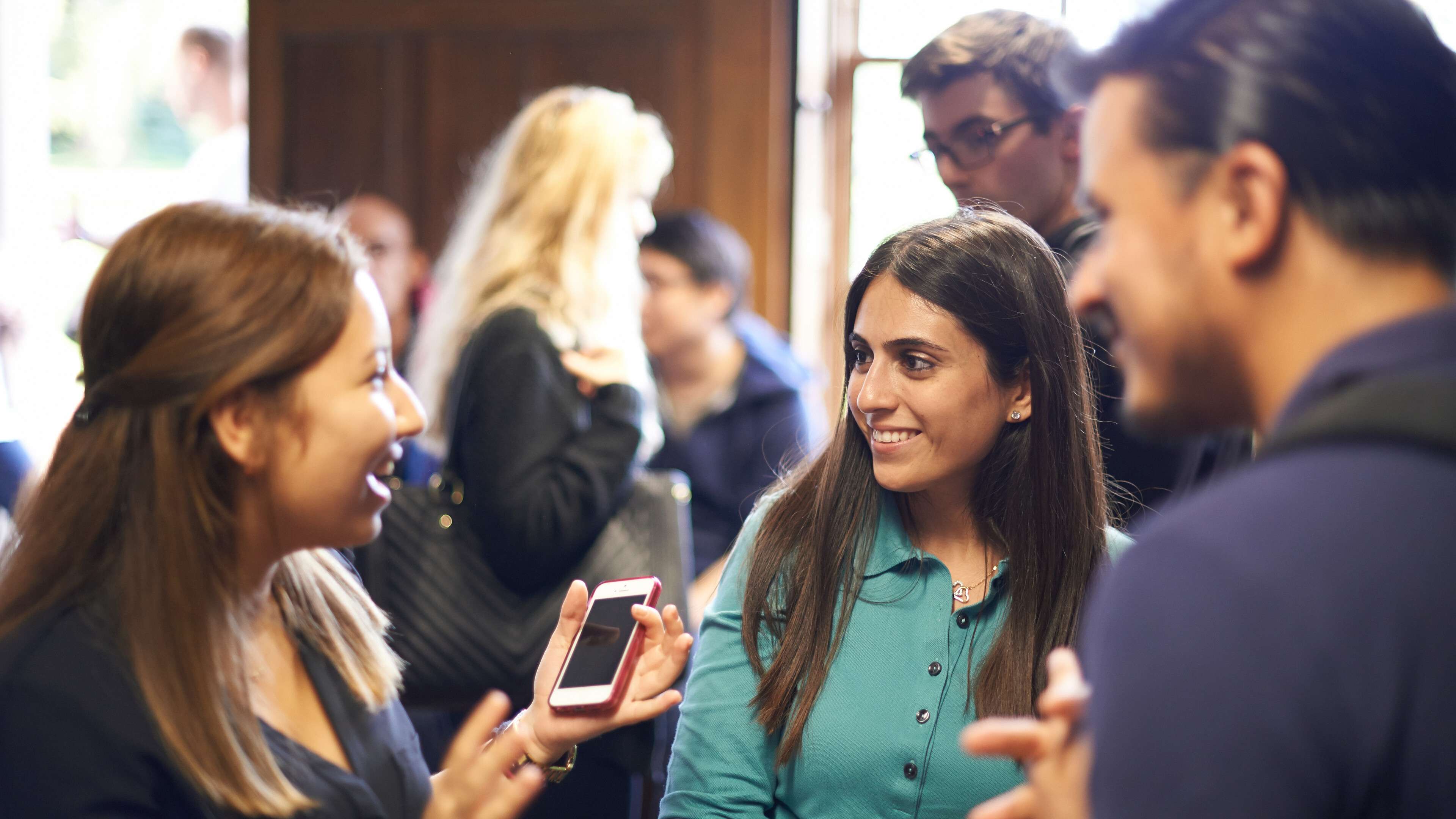 UEA alumni conversing