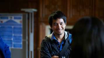 Student smiling in discussion in the Law School