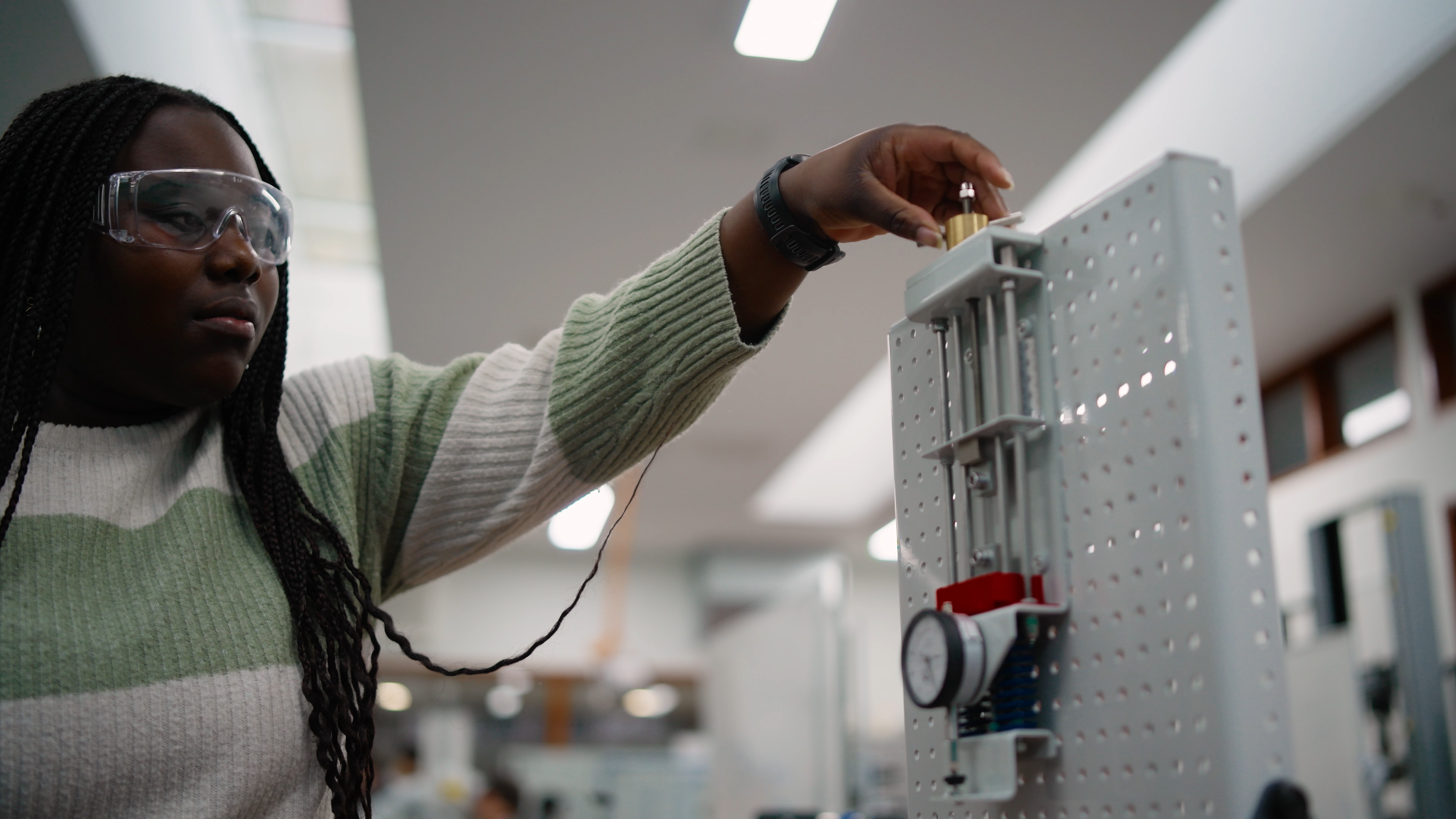 Physics student using equipment