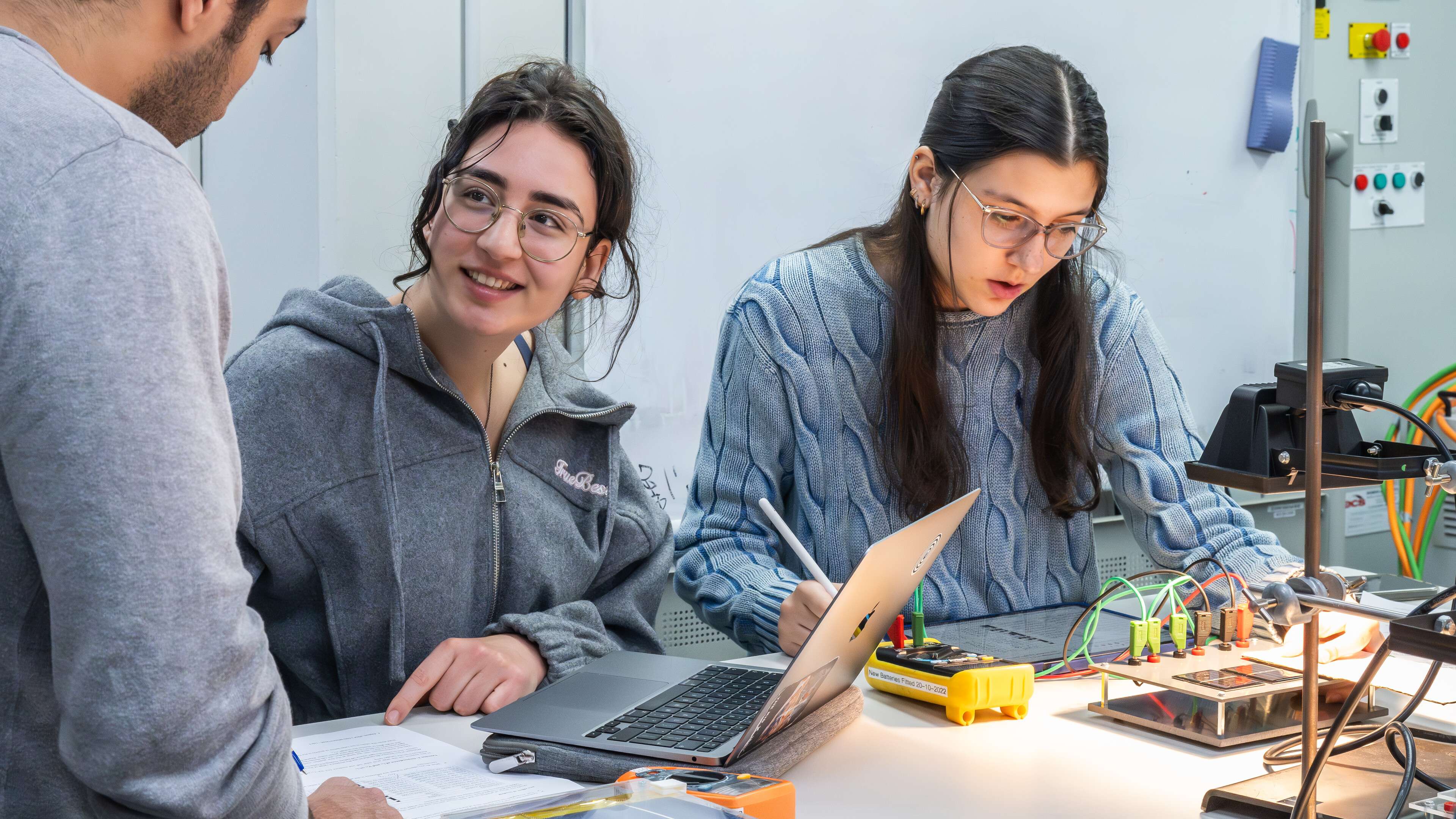 Engineering students using equipment in Productivity East