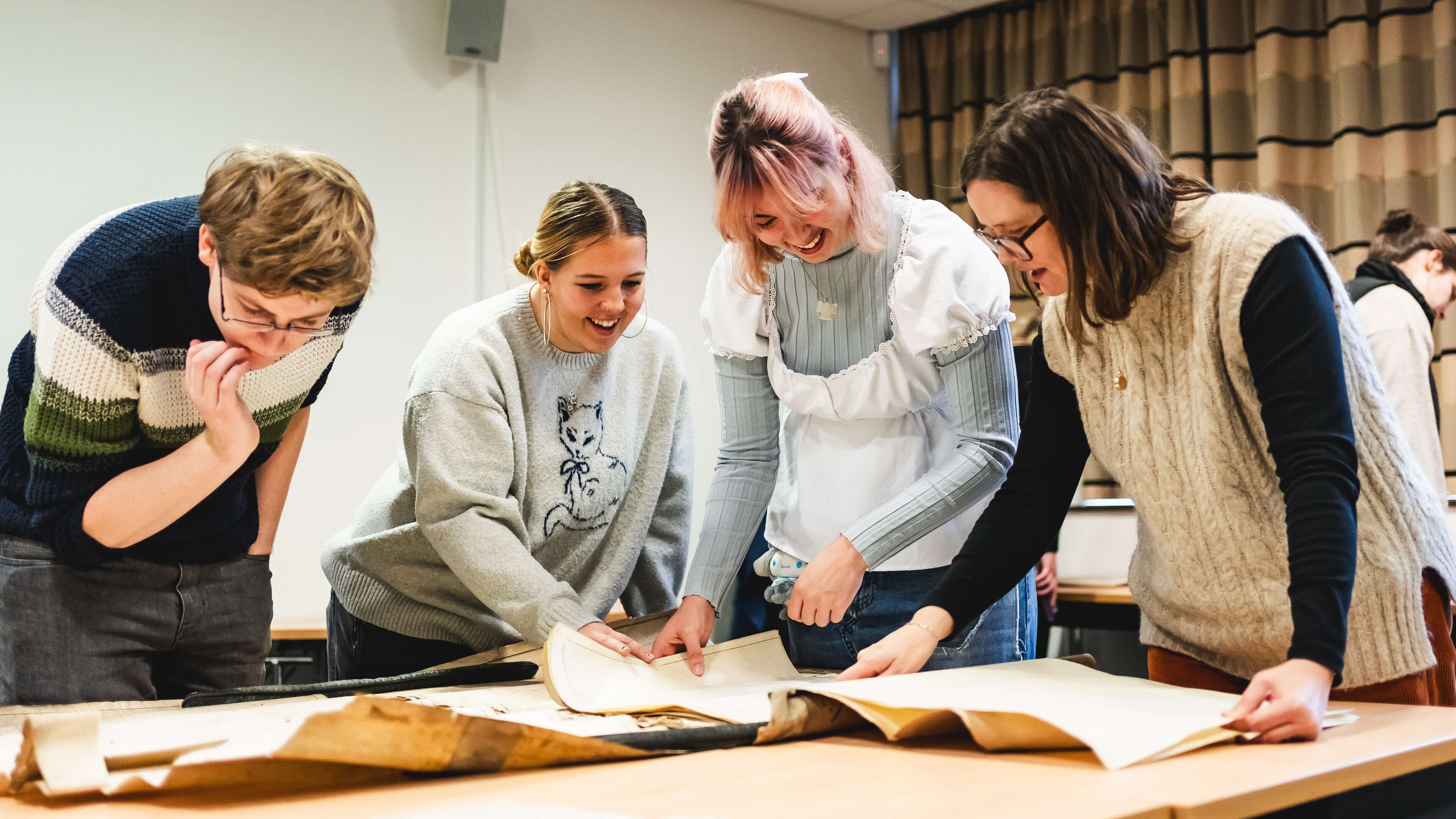 History students examining items in the Archives