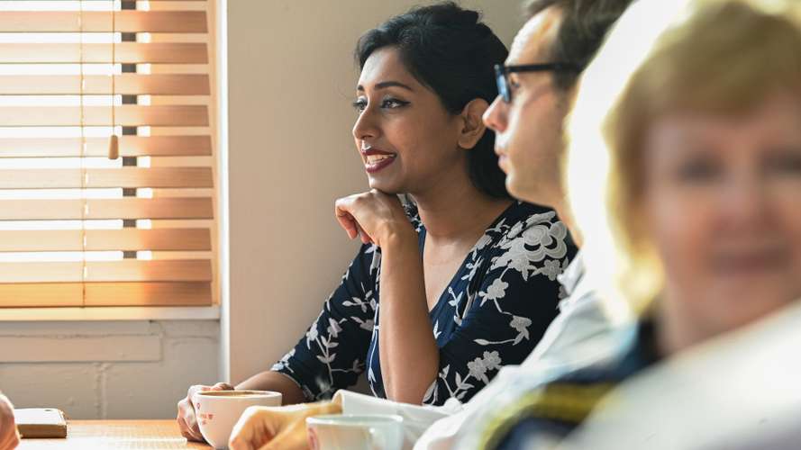 UEA staff members enjoying a coffee break together in the Vista cafe.