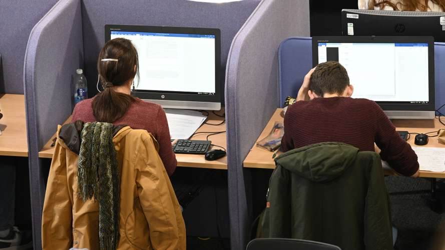 UEA students are pictured using one of the computer suites in the library on campus.