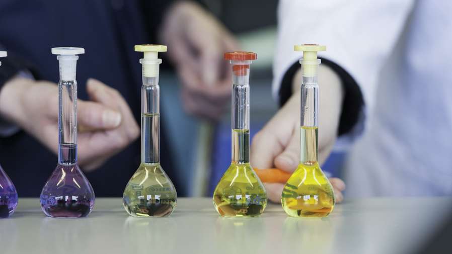 Test tubes and vials full of various coloured liquids