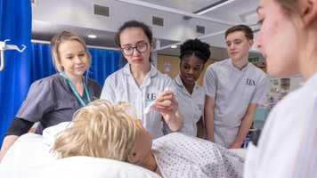 Nursing students working together during a learning session