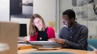 Postgraduate students studying together