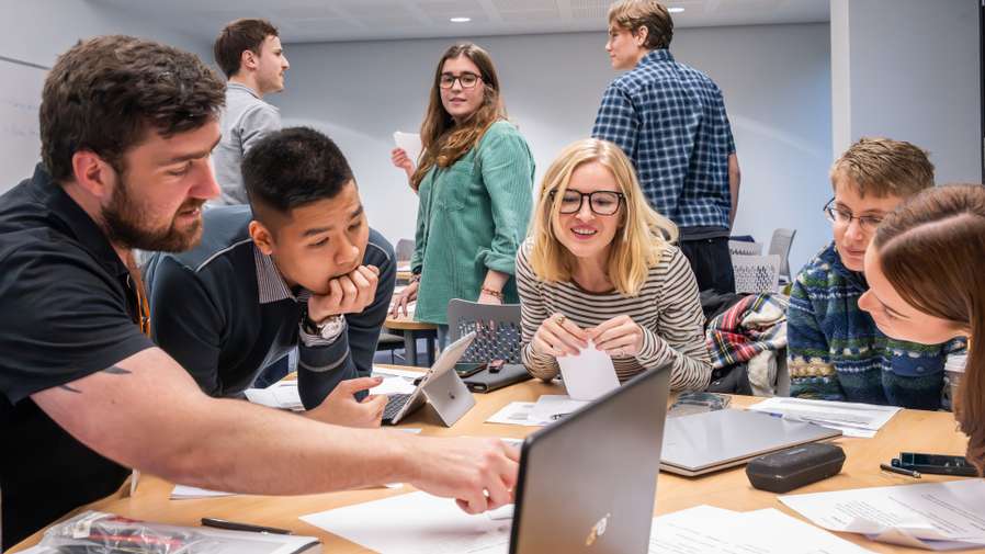 Politics & IR students working together in the War Game simulation session in the NEWSCI Building.