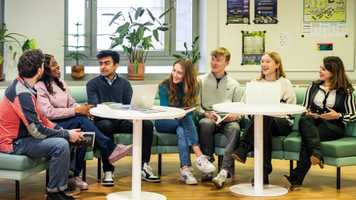 A group of economics students in discussion