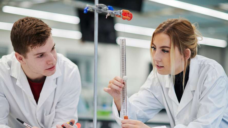 Mature students carrying out a Physics experiment in New Science Building laboratory.
