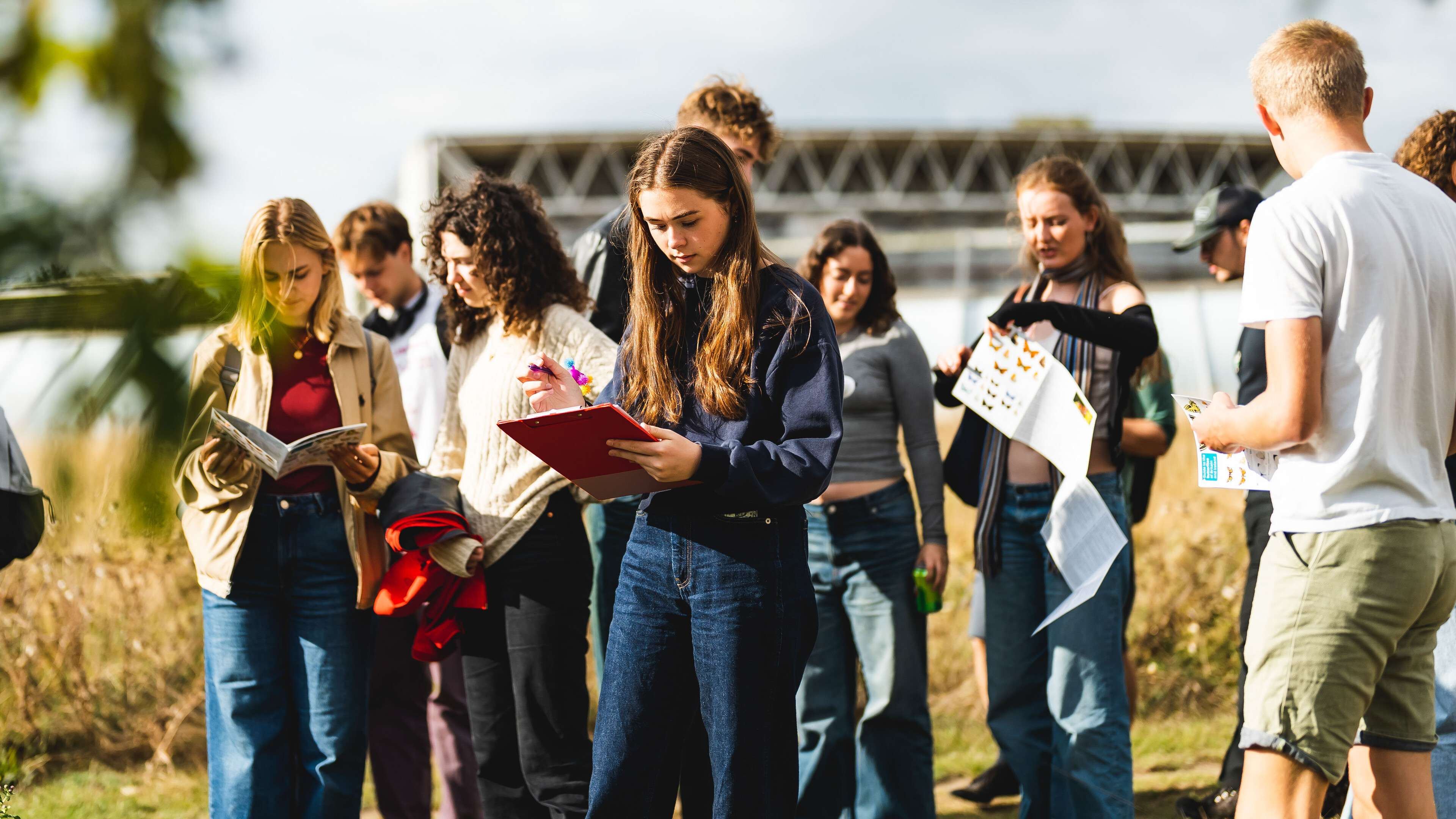 Environmental science and geography students on campus, taking part in an outdoor field activity.