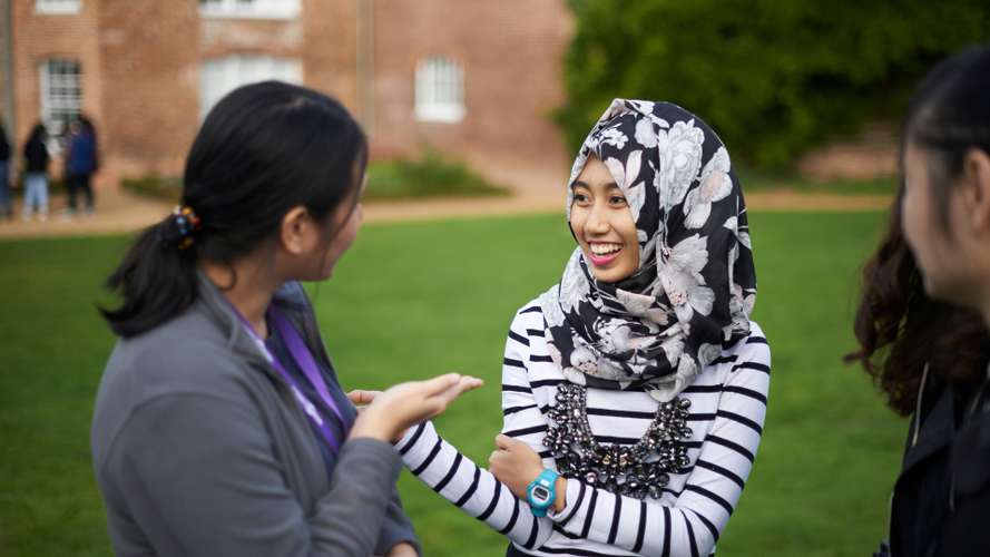 Postgraduate Law School students outside Earlham Hall on campus.