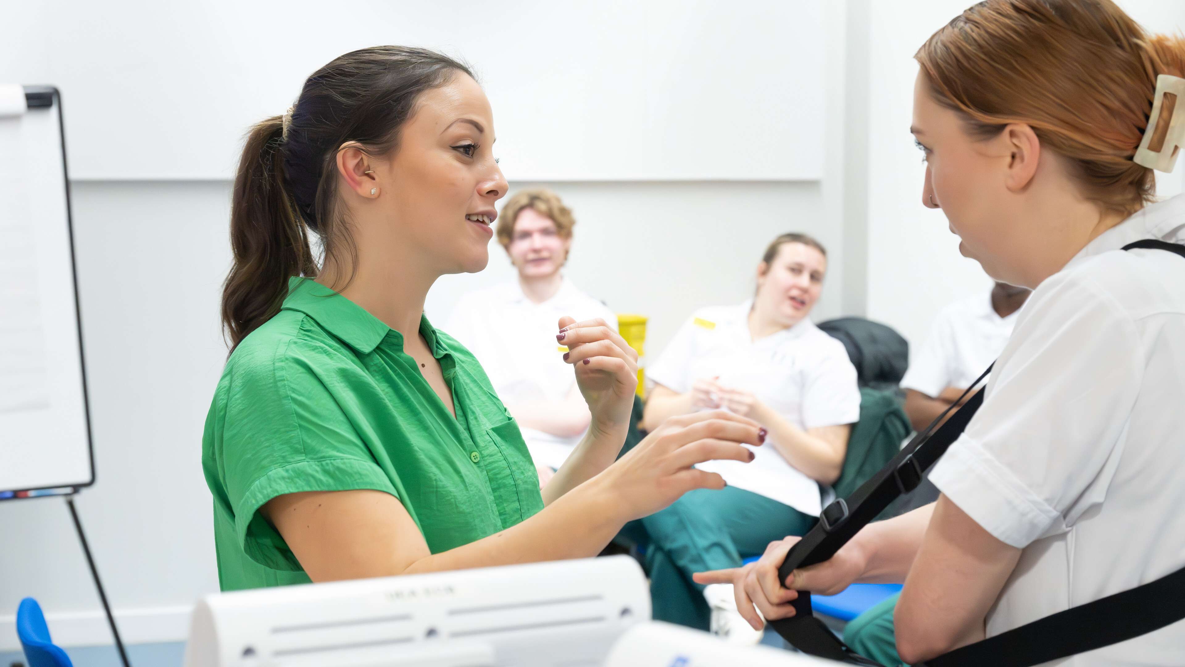 Physiotherapy students working together in a simulation session at Edith Cavell Building