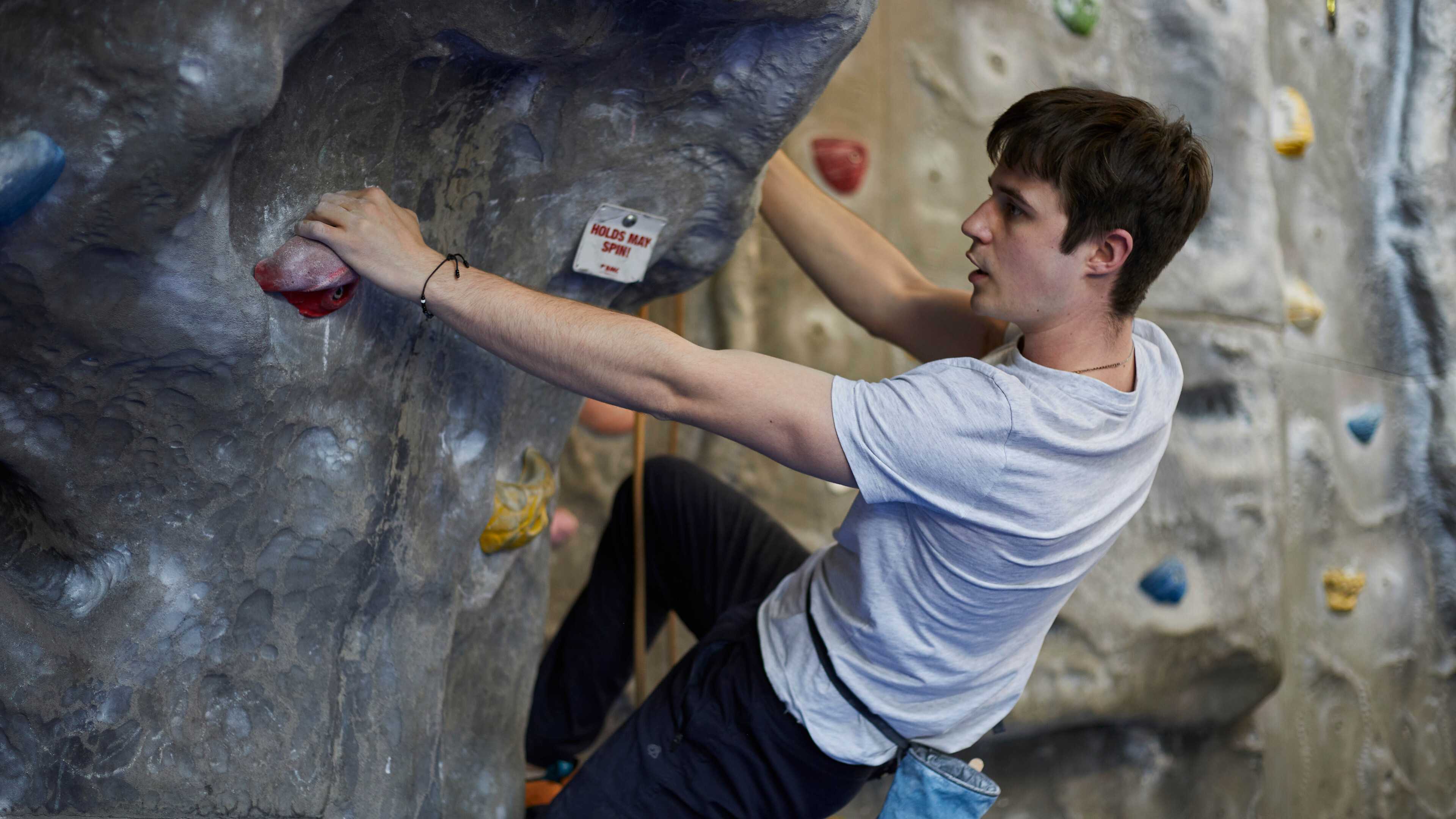 Student on climbing wall