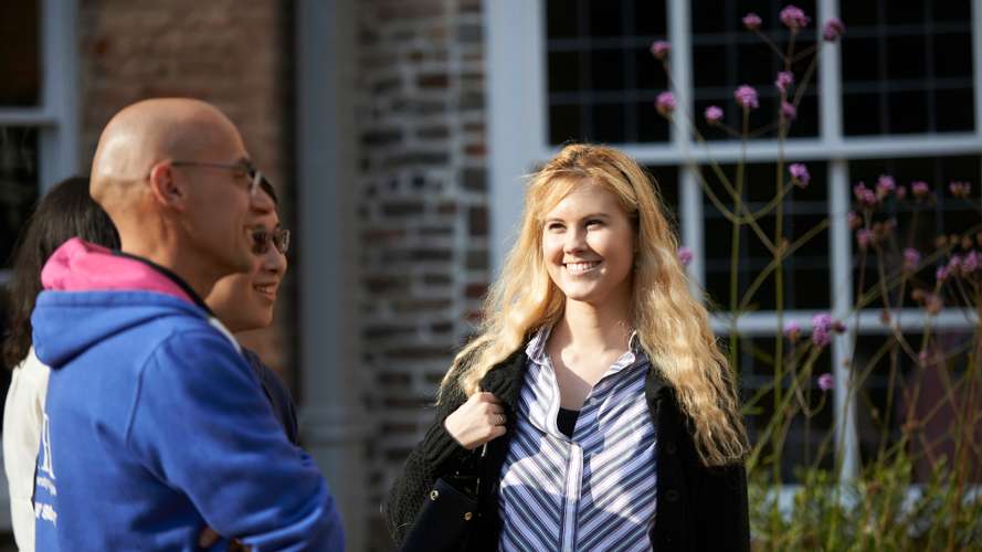 Postgraduate Law School students outside Earlham Hall on campus.