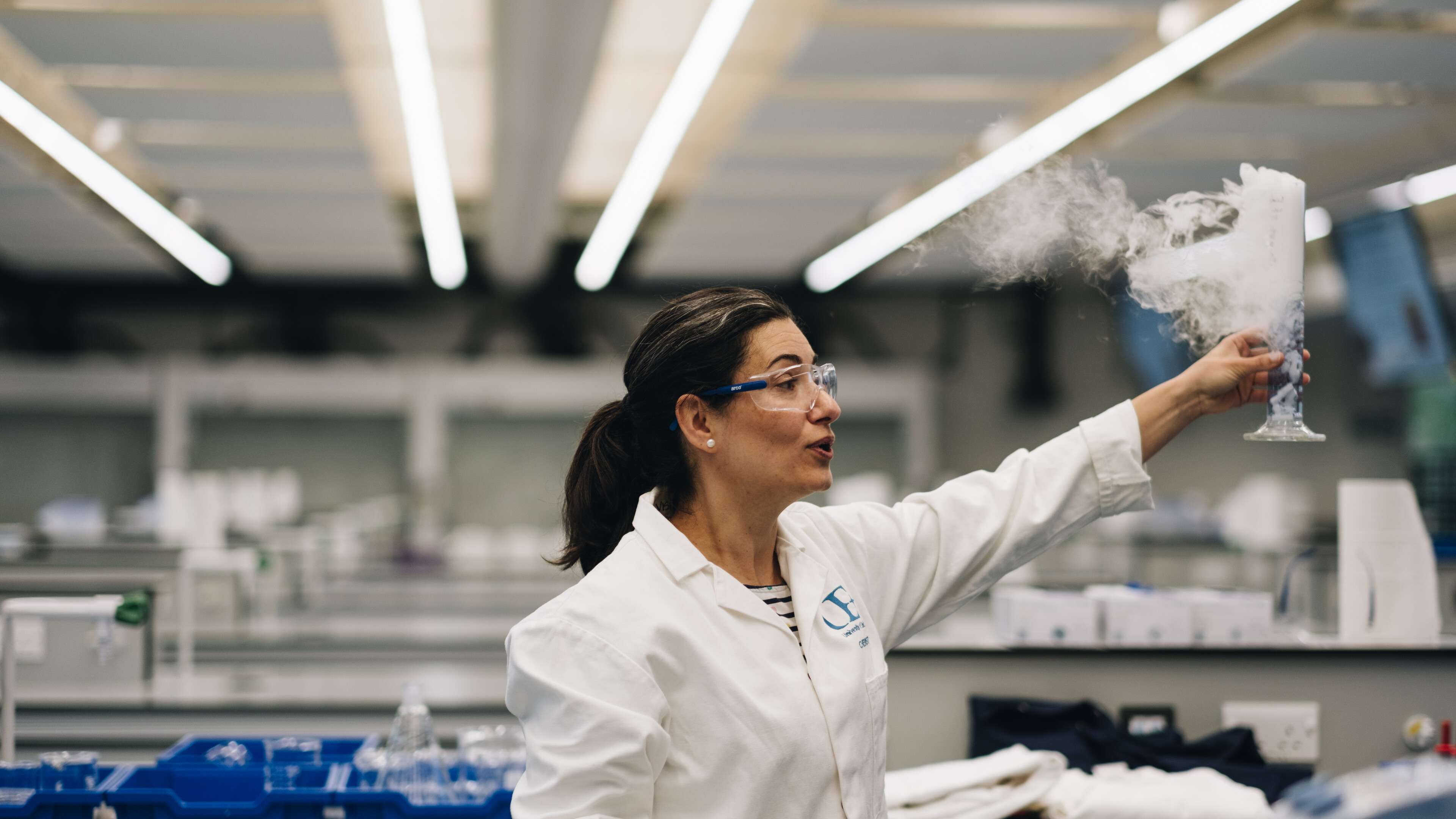 Chemistry lecturer conducting a lab experiment