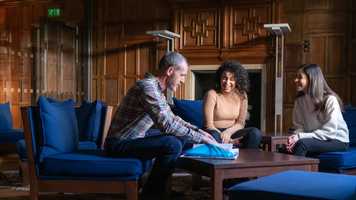 Postgraduate students talking and laughing